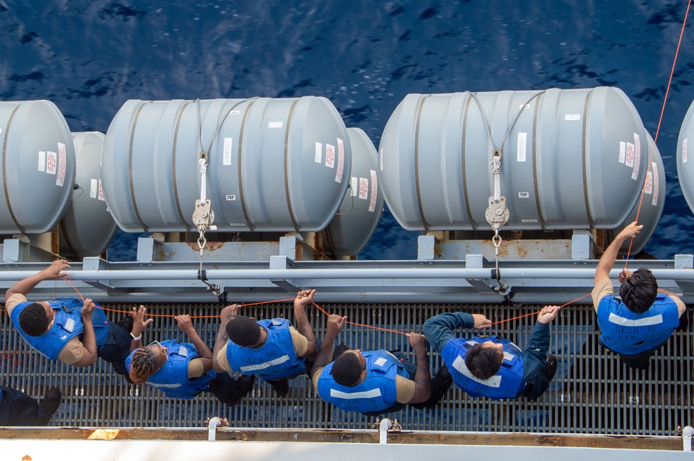 USS Ronald Reagan (CVN 76) conducts fueling-at-sea with USS Robert Smalls (CG 62)