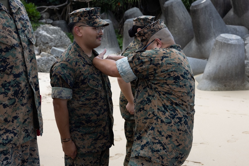 U.S. Navy Sailors are awarded the Fleet Marine Force pin