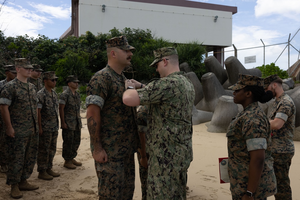 U.S. Navy Sailors are awarded the Fleet Marine Force pin