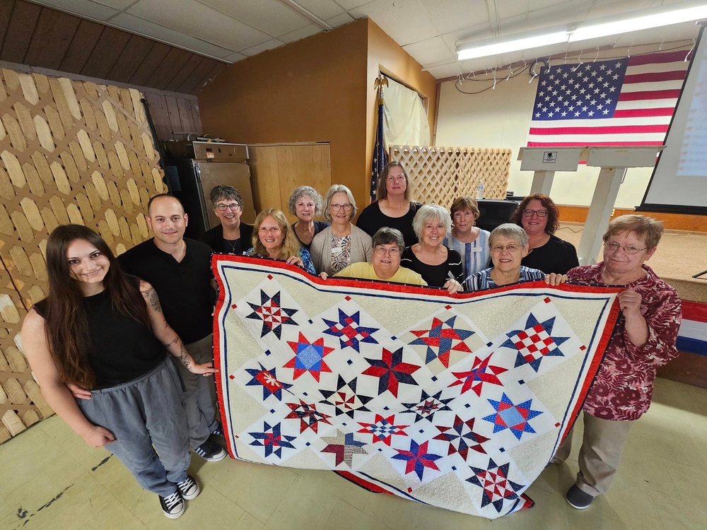 Fort McCoy dispatcher, Air Force veteran, receives Quilt of Valor in special ceremony