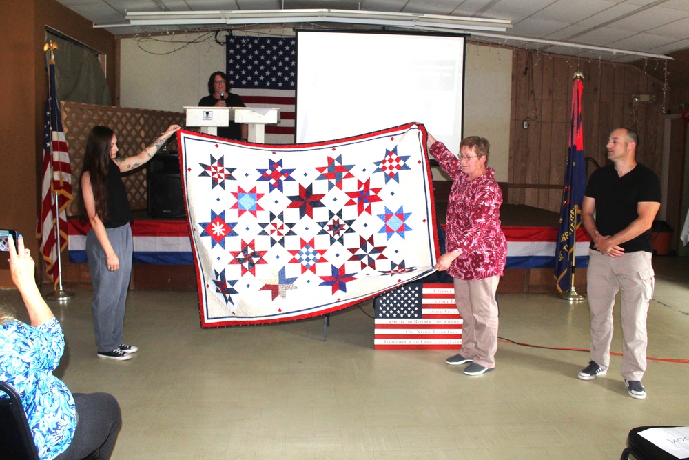 Fort McCoy dispatcher, Air Force veteran, receives Quilt of Valor in special ceremony