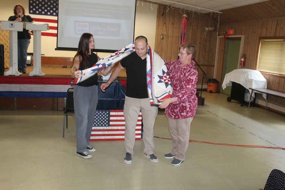 Fort McCoy dispatcher, Air Force veteran, receives Quilt of Valor in special ceremony