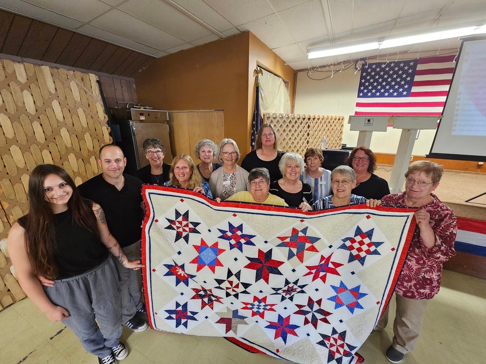Fort McCoy dispatcher, Air Force veteran, receives Quilt of Valor in special ceremony