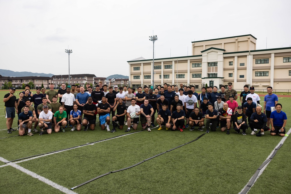 U.S. Marines and members of Japan Self Defense Force compete in a rugby match at Marine Corps Air Station Iwakuni