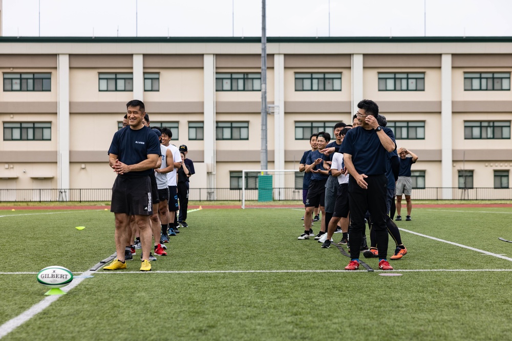 U.S. Marines and members of Japan Self Defense Force compete in a rugby match at Marine Corps Air Station Iwakuni