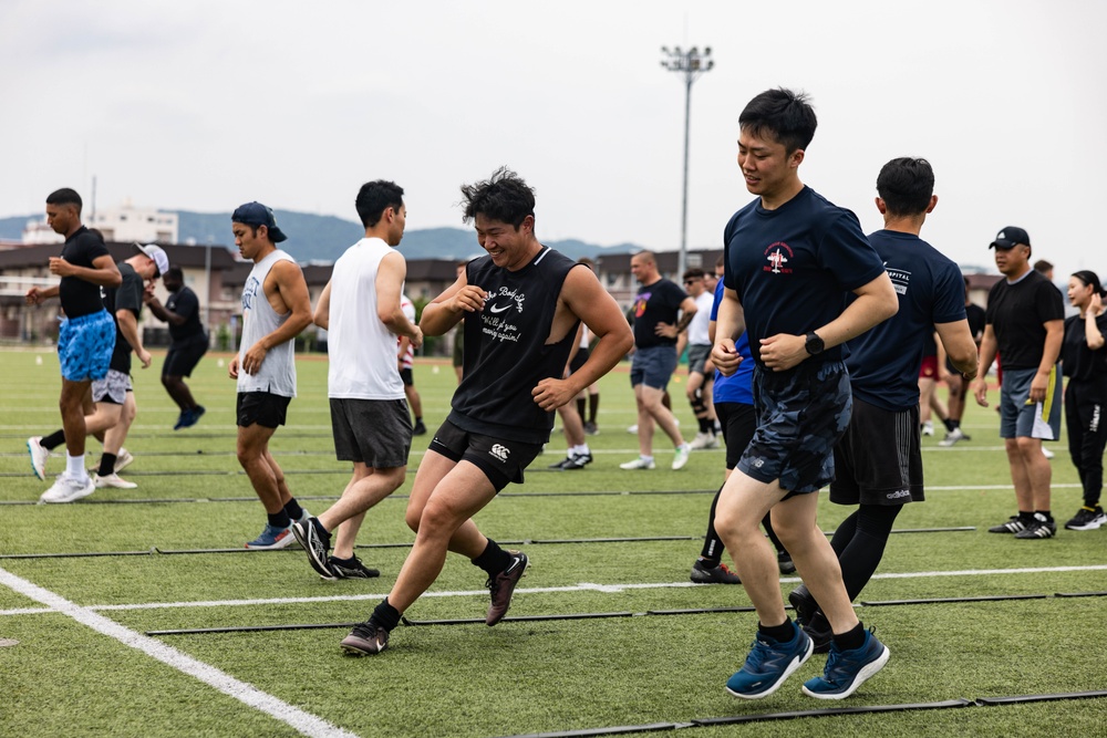 U.S. Marines and members of Japan Self Defense Force compete in a rugby match at Marine Corps Air Station Iwakuni