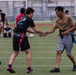 U.S. Marines and members of Japan Self Defense Force compete in a rugby match at Marine Corps Air Station Iwakuni