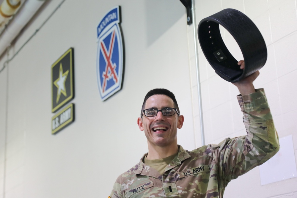 1LT Hutz raises his belt in excitement after joining the 1,000 lbs. club