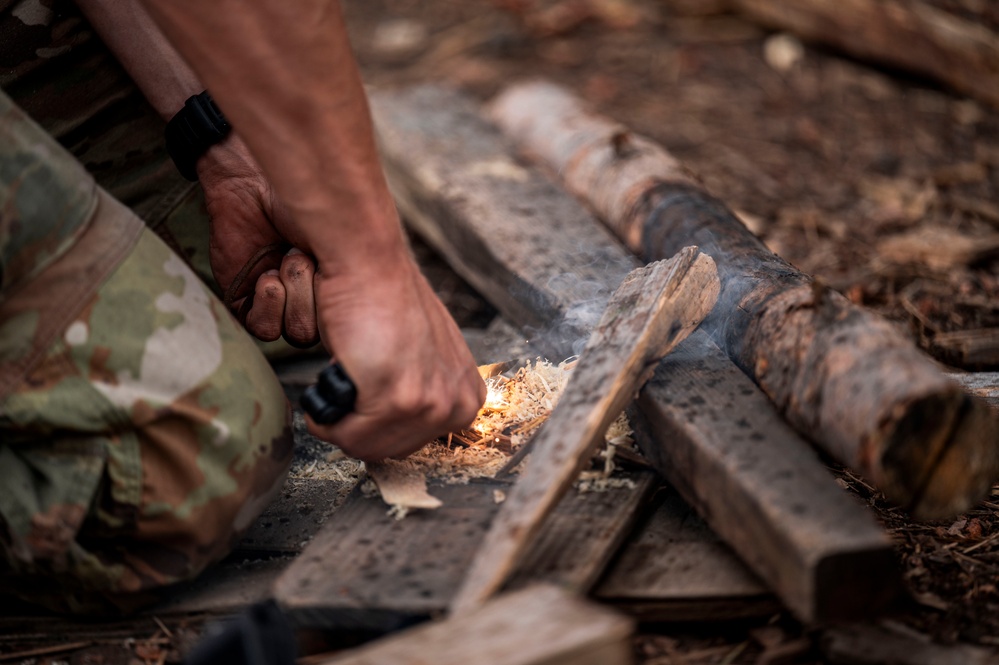 Survival, Evasion, Resistance, and Escape pre-team 25-A particpates in firecraft exercise