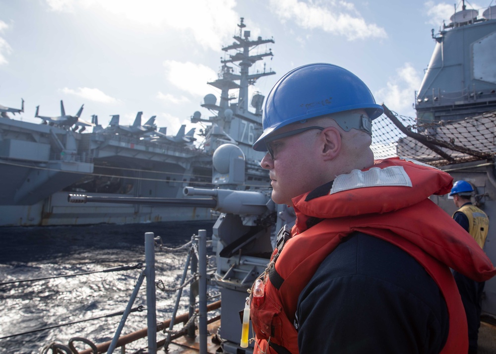 USS Robert Smalls (CG 62) conducts fueling-at-sea with USS Ronald Reagan (CVN 76)