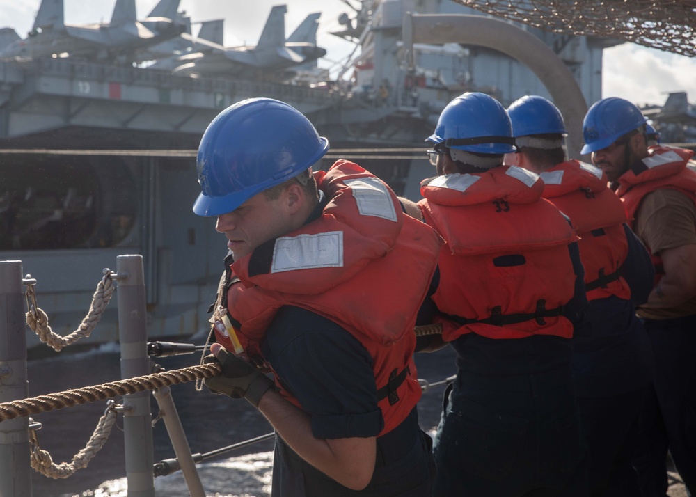 USS Robert Smalls (CG 62) conducts fueling-at-sea with USS Ronald Reagan (CVN 76)