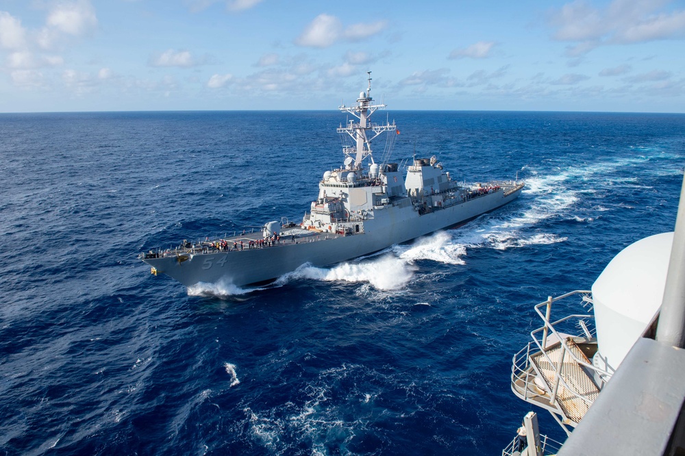 USS Ronald Reagan (CVN 76) conducts fueling-at-sea with USS Curtis Wilbur (DDG 54)