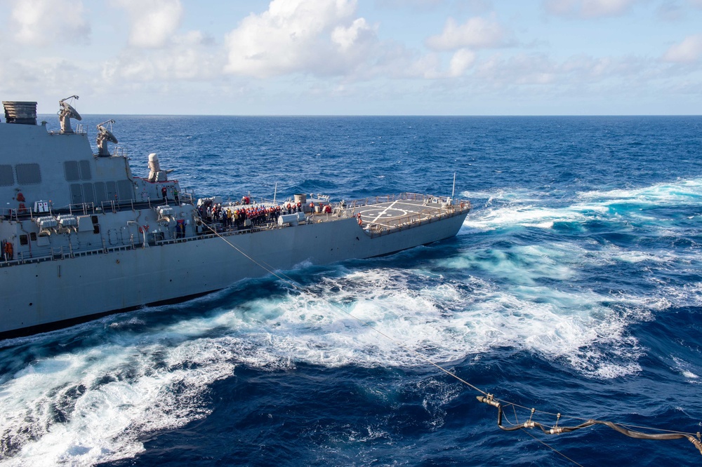 USS Ronald Reagan (CVN 76) conducts fueling-at-sea with USS Curtis Wilbur (DDG 54)