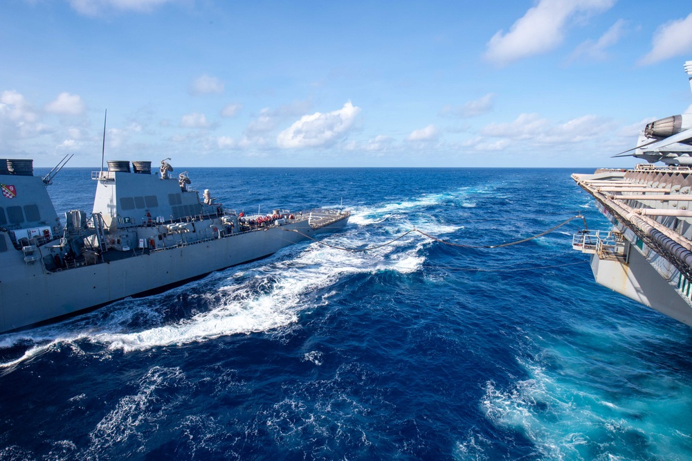 USS Ronald Reagan (CVN 76) conducts fueling-at-sea with USS Curtis Wilbur (DDG 54)