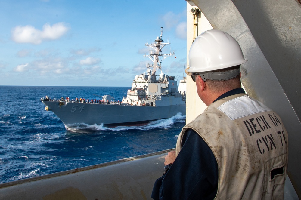 USS Ronald Reagan (CVN 76) conducts fueling-at-sea with USS Curtis Wilbur (DDG 54)