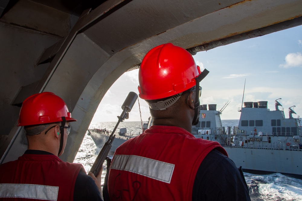 USS Ronald Reagan (CVN 76) conducts fueling-at-sea with USS Curtis Wilbur (DDG 54)