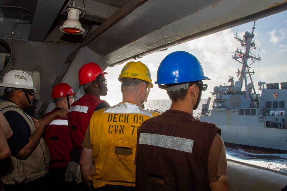 USS Ronald Reagan (CVN 76) conducts fueling-at-sea with USS Curtis Wilbur (DDG 54)