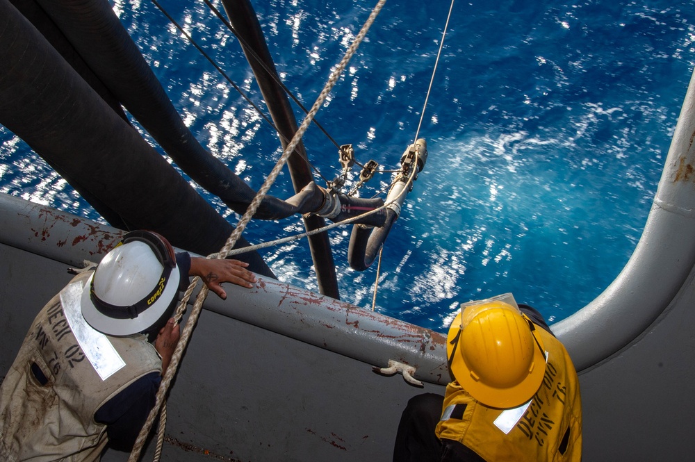 USS Ronald Reagan (CVN 76) conducts fueling-at-sea with USS Curtis Wilbur (DDG 54)