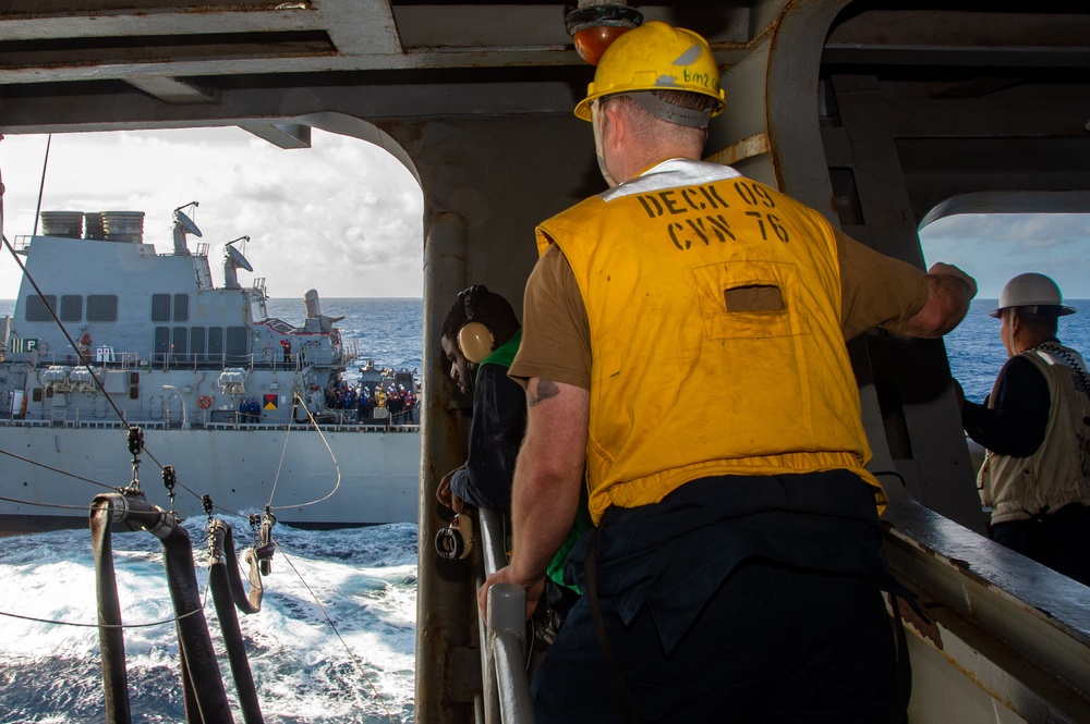 USS Ronald Reagan (CVN 76) conducts fueling-at-sea with USS Curtis Wilbur (DDG 54)