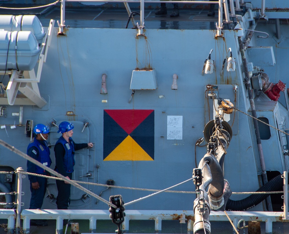 USS Ronald Reagan (CVN 76) conducts fueling-at-sea with USS Curtis Wilbur (DDG 54)