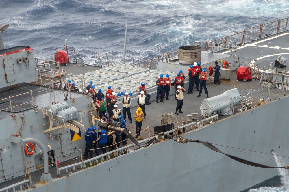 USS Ronald Reagan (CVN 76) conducts fueling-at-sea with USS Curtis Wilbur (DDG 54)