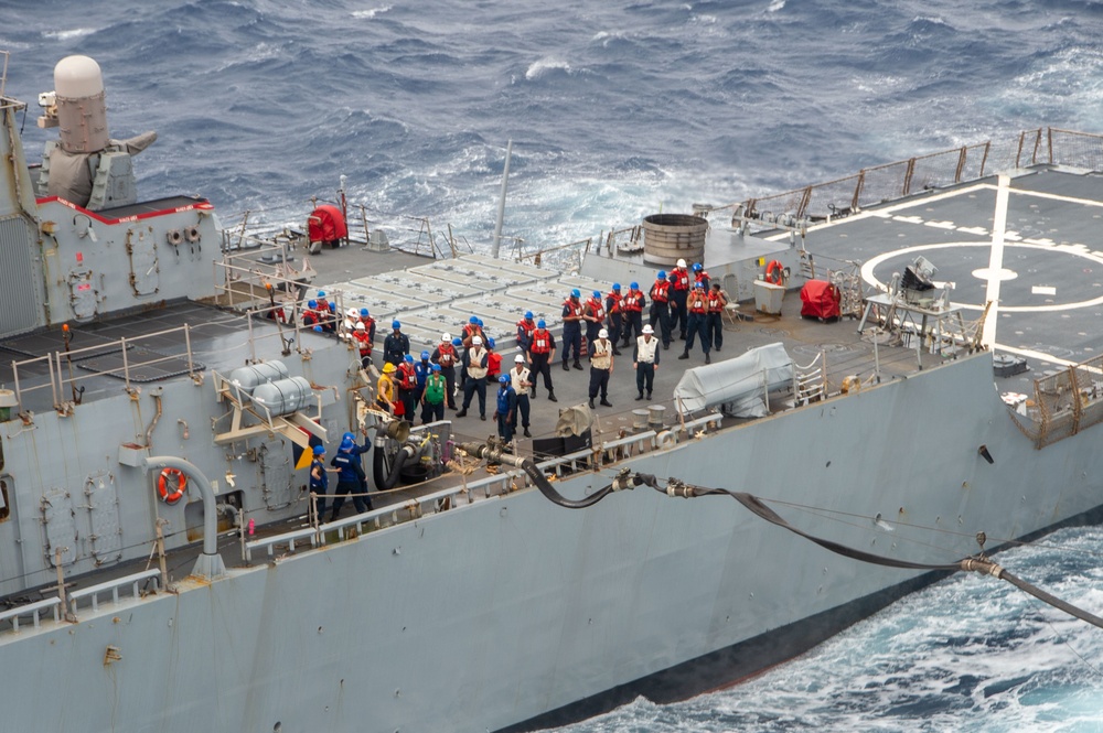 USS Ronald Reagan (CVN 76) conducts fueling-at-sea with USS Curtis Wilbur (DDG 54)