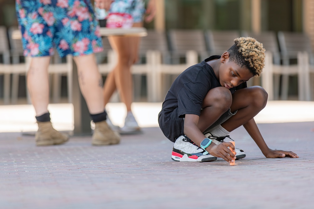 Shoppers chalk the block at Bliss open-air marketplace