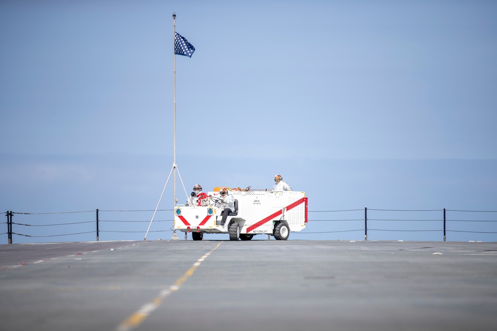 USS Tripoli Sailors execute fire deck firefighting drill