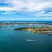Aerial view of ships moored at Pearl Harbor and Ford Island during RIMPAC 2024