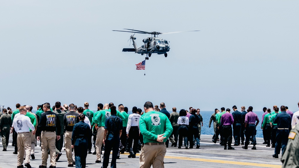 HSM-46 Flies an American Flag over the Flight Deck of George Washington