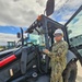 EOC Earley stands with his excavator at Joint Base Pearl Harbor-Hickam during RIMPAC 2024