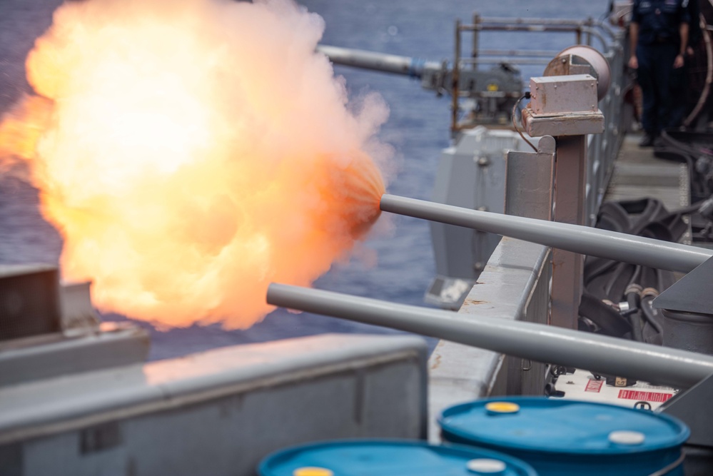 USS Ronald Reagan (CVN 76) performs a 21 gun salute for 4th of July