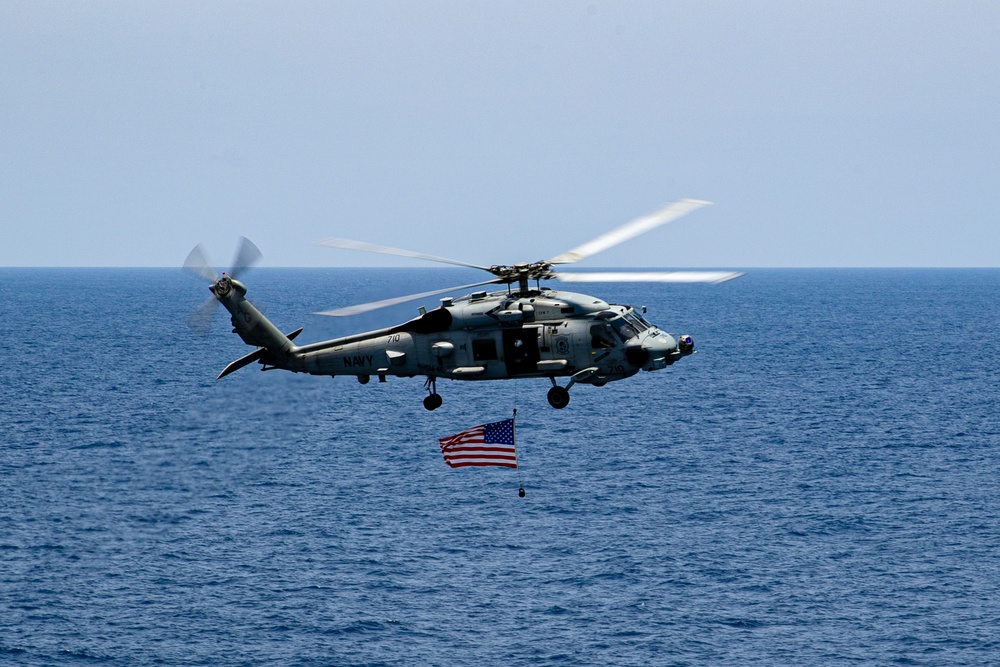 HSM-46 Flies an American Flag over the Flight Deck of George Washington