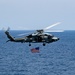 HSM-46 Flies an American Flag over the Flight Deck of George Washington