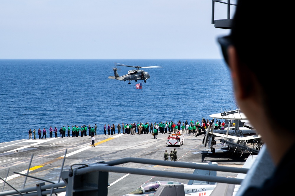 HSM-46 Flies an American Flag over the Flight Deck of George Washington