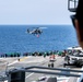 HSM-46 Flies an American Flag over the Flight Deck of George Washington