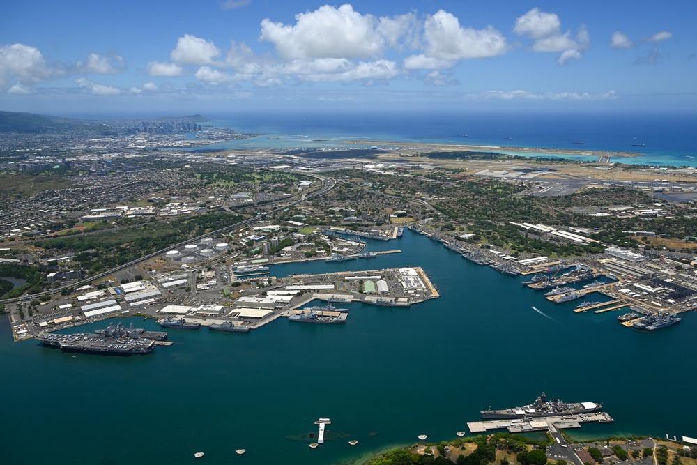 Aerial view of ships moored at Pearl Harbor and Ford Island during RIMPAC 2024