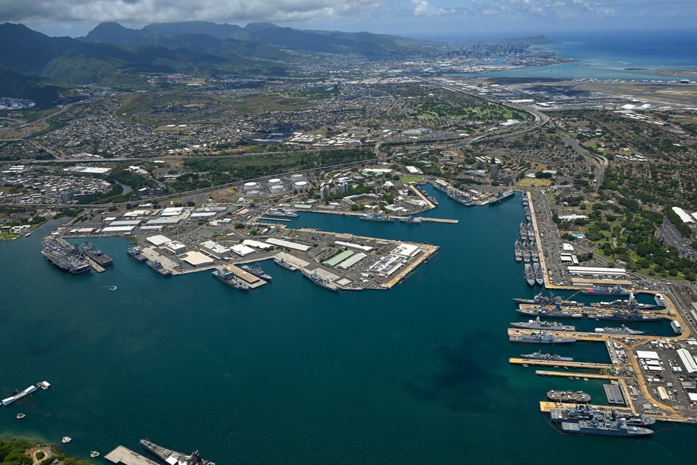 Aerial view of ships moored at Pearl Harbor and Ford Island during RIMPAC 2024