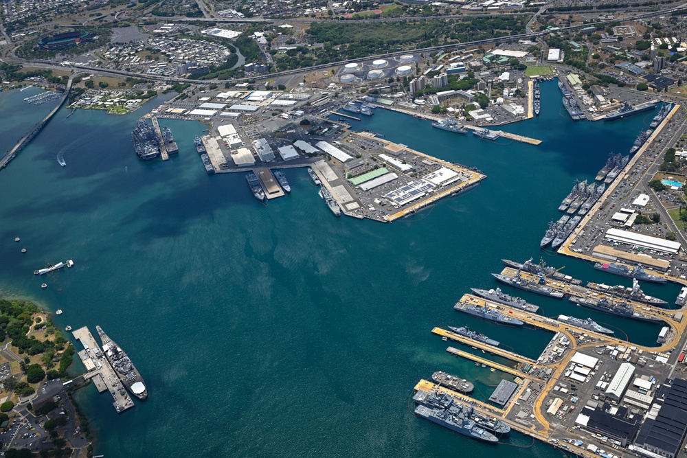 Aerial view of ships moored at Pearl Harbor and Ford Island during RIMPAC 2024