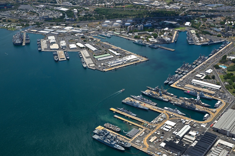 Aerial view of ships moored at Pearl Harbor and Ford Island during RIMPAC 2024