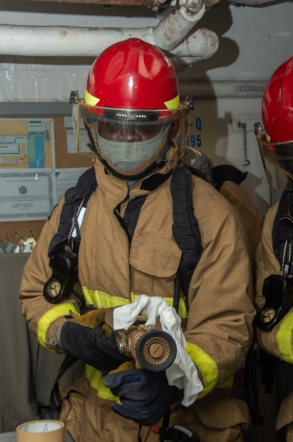 USS Ronald Reagan (CVN 76) Sailors conduct casualty response training during general quarters