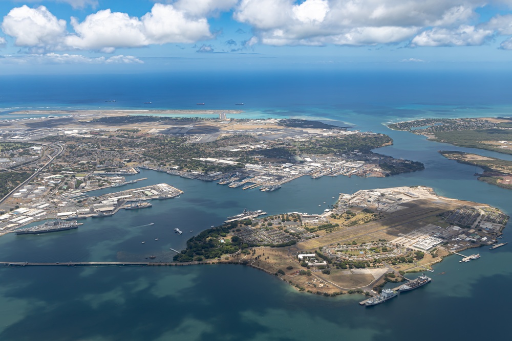 Aerial view of ships moored at Pearl Harbor and Ford Island during RIMPAC 2024