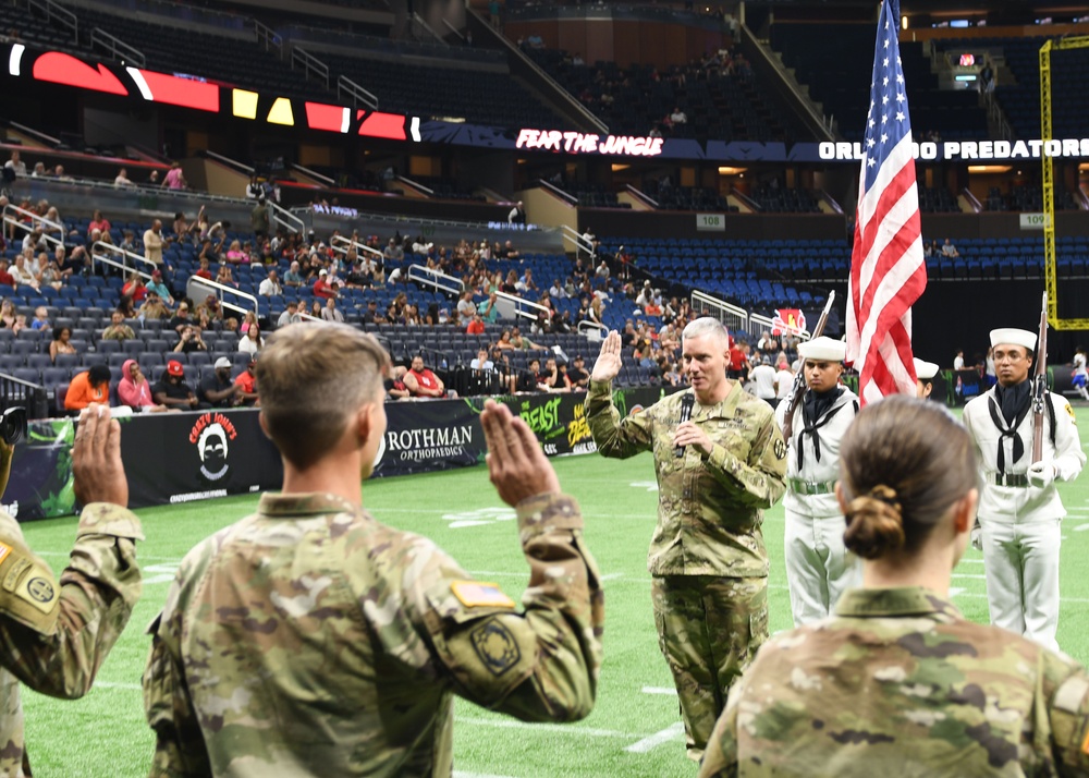 AR-MEDCOM DCG Collard leads Affirmation of Enlistment Ceremony at Arena Football game