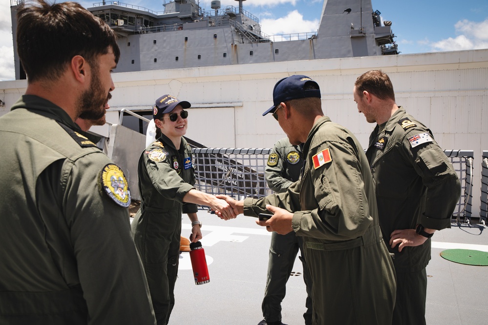 Media conduct interviews aboard Australian HMAS Sydney