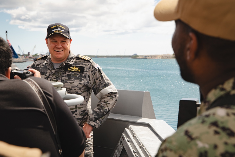 Media conduct interviews with CO of HMAS Sydney, COMD Billy Maddison