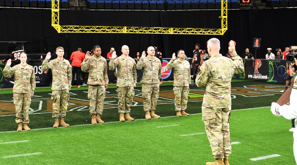 AR-MEDCOM DCG Collard leads Affirmation of Enlistment Ceremony at Arena Football game