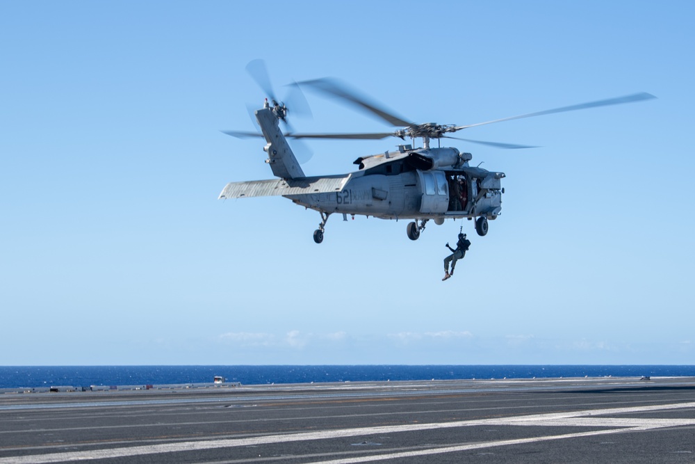 Sailors from HSC-12 conduct a hoisting exercise aboard USS Ronald Reagan (CVN 76)