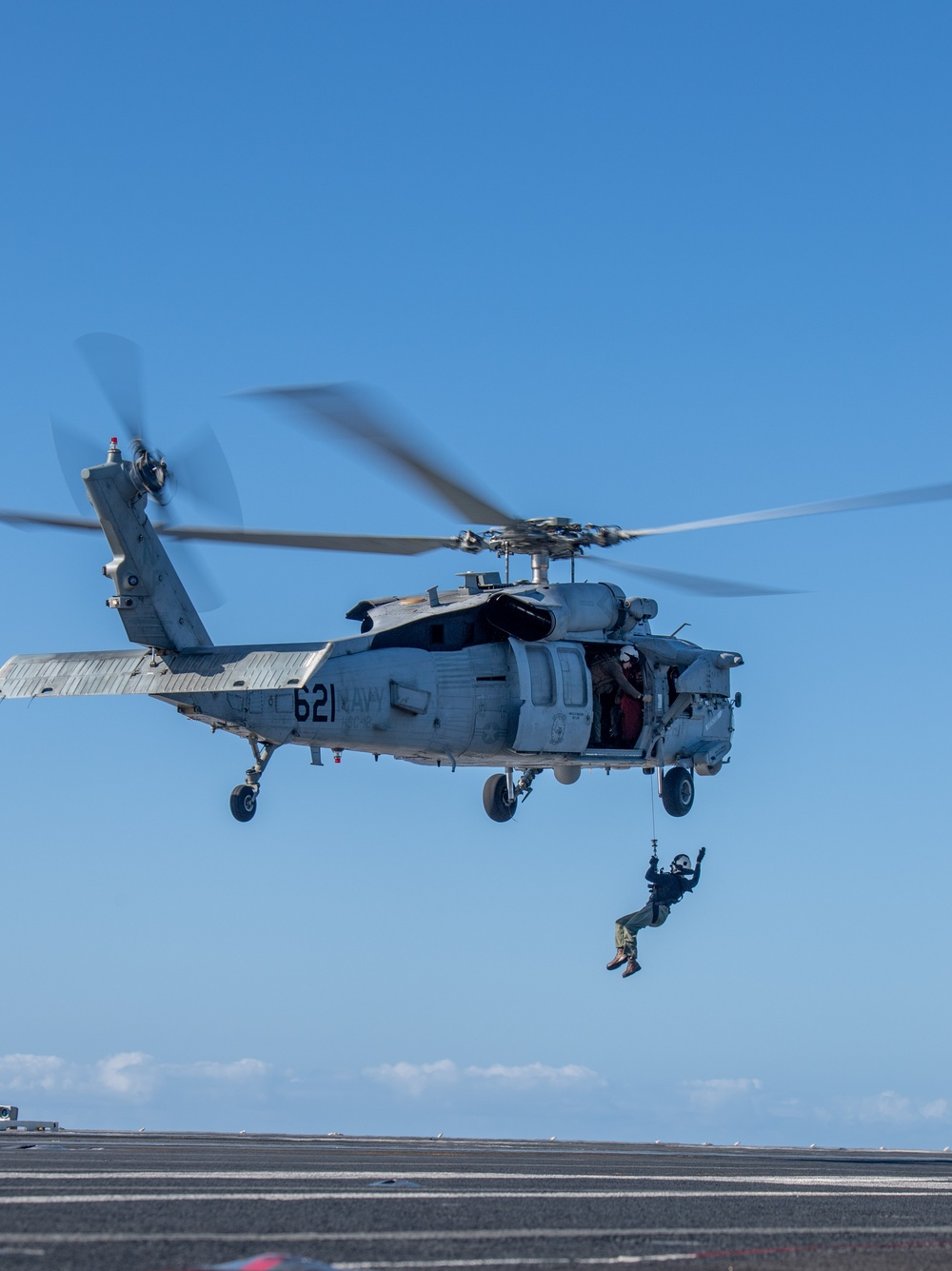 Sailors from HSC-12 conduct a hoisting exercise aboard USS Ronald Reagan (CVN 76)