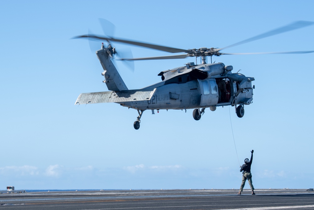 Sailors from HSC-12 conduct a hoisting exercise aboard USS Ronald Reagan (CVN 76)