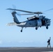 Sailors from HSC-12 conduct a hoisting exercise aboard USS Ronald Reagan (CVN 76)